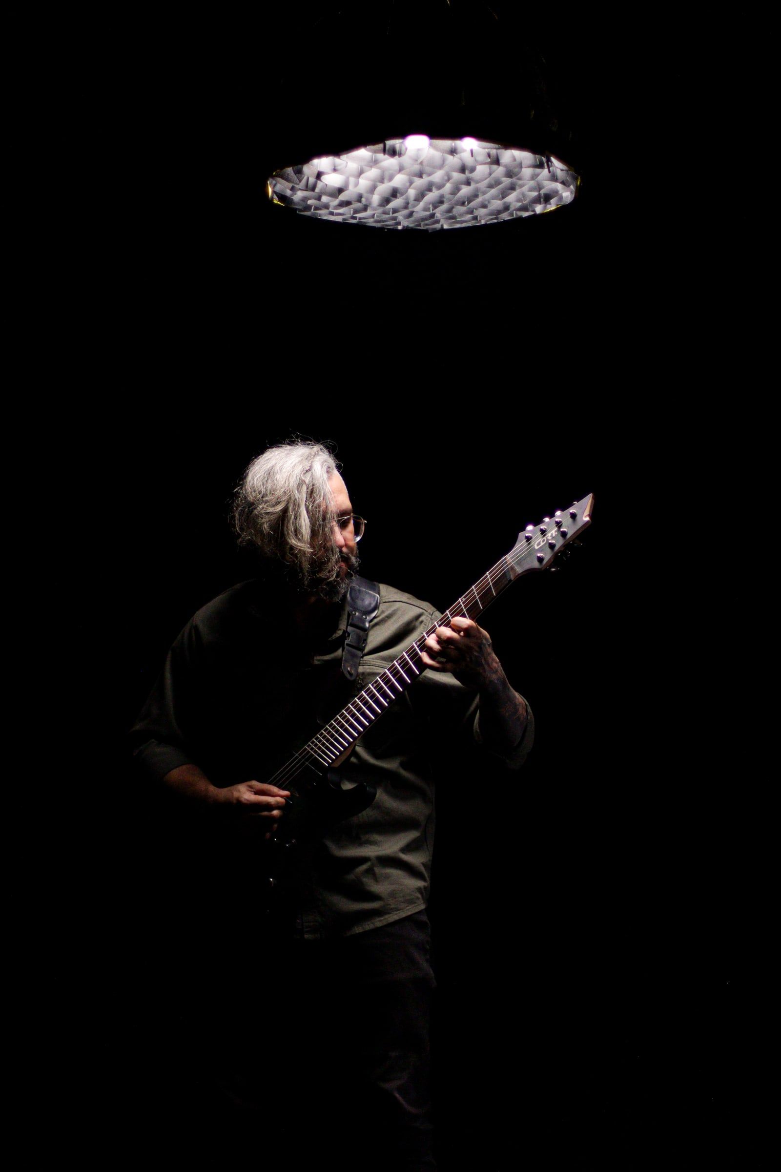 8K guitarist under a single light, 2024 promo session